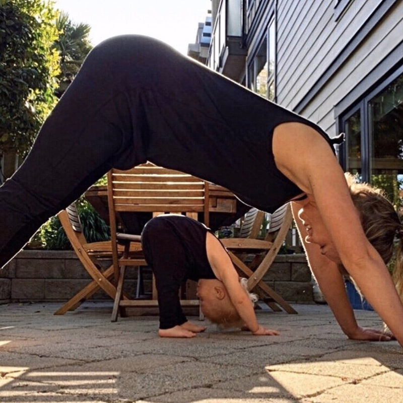 Mom + Toddler doing yoga together / downward facing dogs in matching one piece Dhoti Onesie